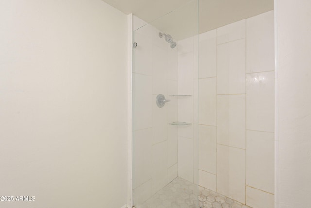 bathroom with tiled shower