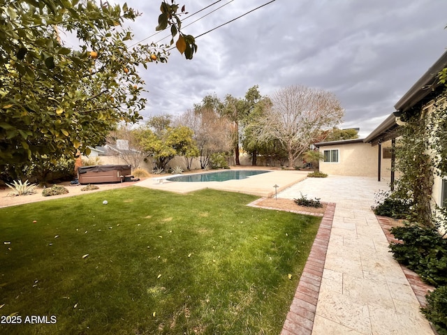 view of yard featuring a patio area, a fenced in pool, a hot tub, and a fenced backyard