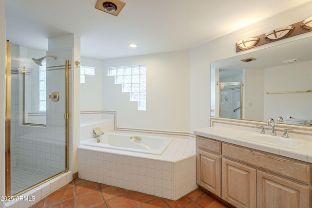 bathroom with vanity, a shower stall, a bath, and tile patterned floors