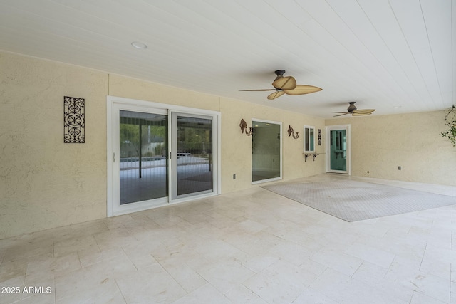 view of patio featuring a ceiling fan