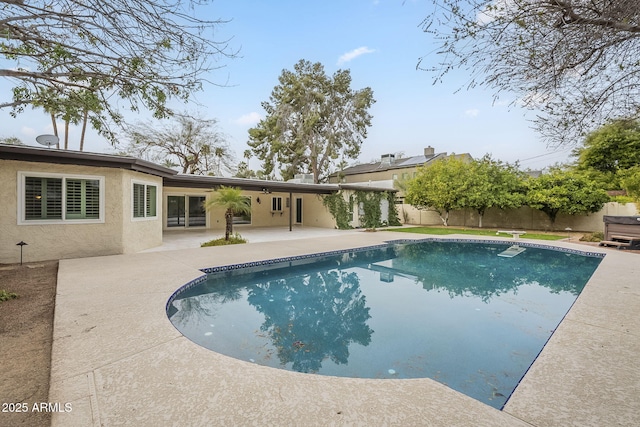 view of pool with a patio area, a fenced in pool, and a fenced backyard