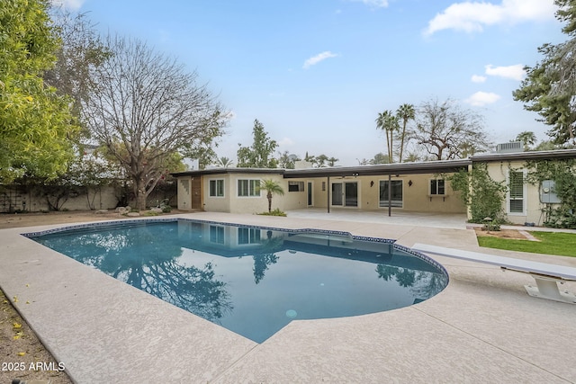 view of pool with a fenced in pool, a patio, and fence