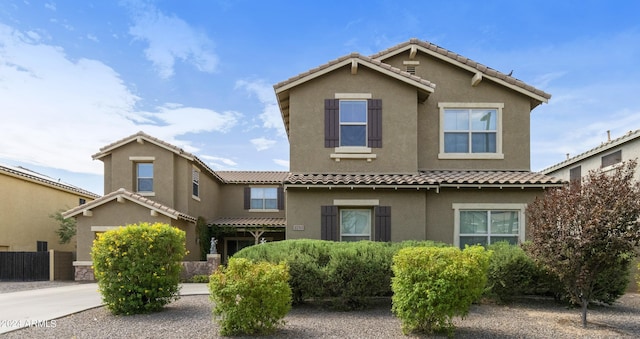 view of front of home with concrete driveway and stucco siding