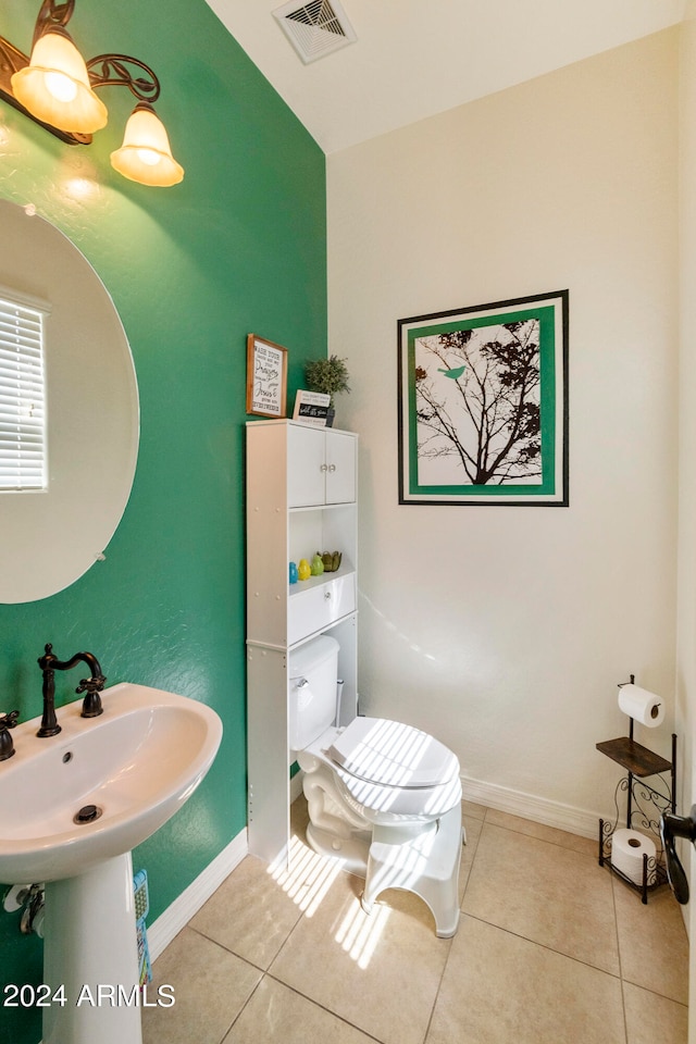 bathroom with tile patterned flooring and toilet