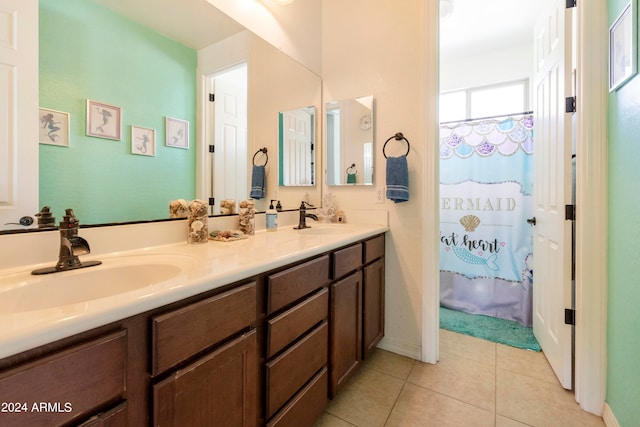 bathroom with dual vanity and tile patterned flooring