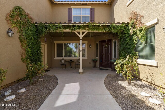 doorway to property featuring a patio area