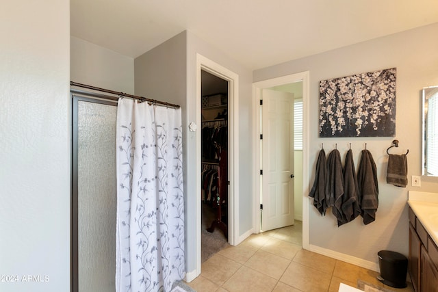 bathroom with vanity and tile patterned flooring