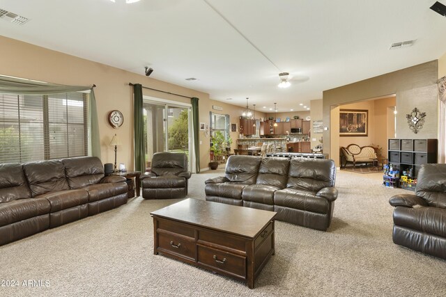 living room featuring light carpet