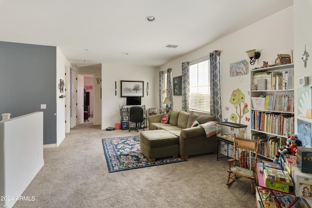 carpeted living room with visible vents and baseboards