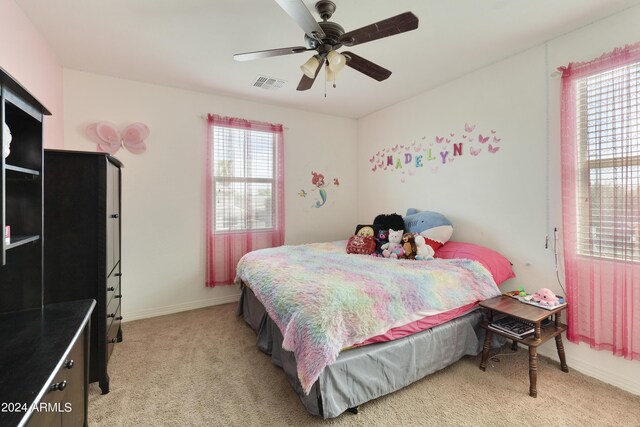 bedroom with light carpet and ceiling fan