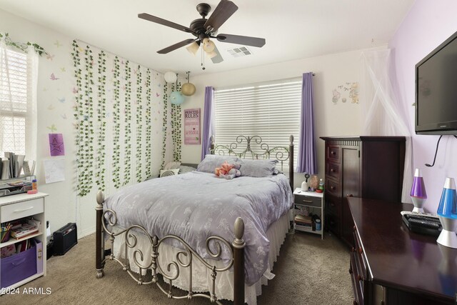 carpeted bedroom with ceiling fan