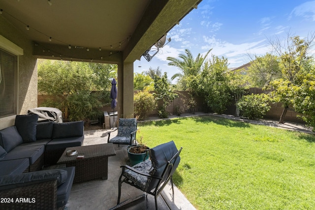 view of yard with a patio area, a fenced backyard, and an outdoor living space