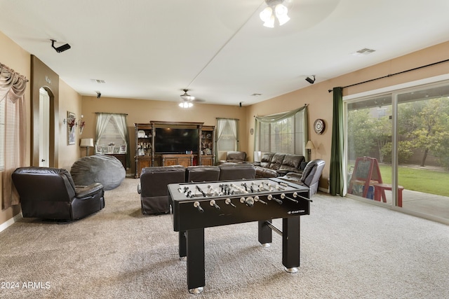 playroom featuring carpet, visible vents, ceiling fan, and baseboards