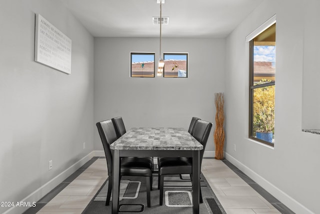 dining room featuring light tile patterned flooring