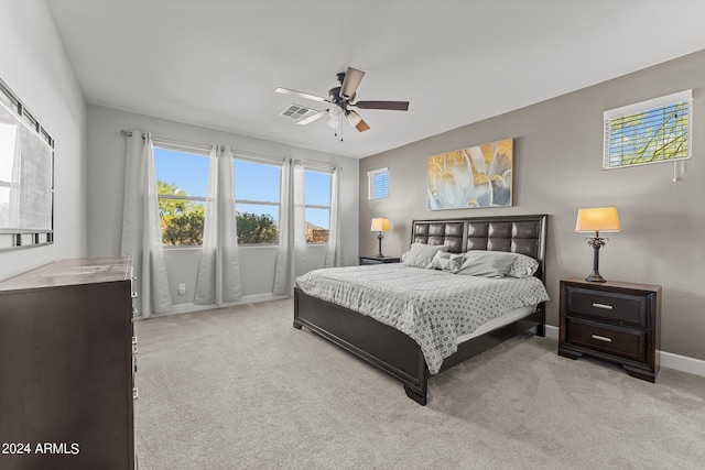 carpeted bedroom with ceiling fan