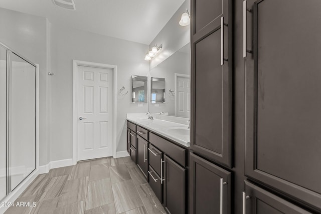 bathroom with vanity and an enclosed shower