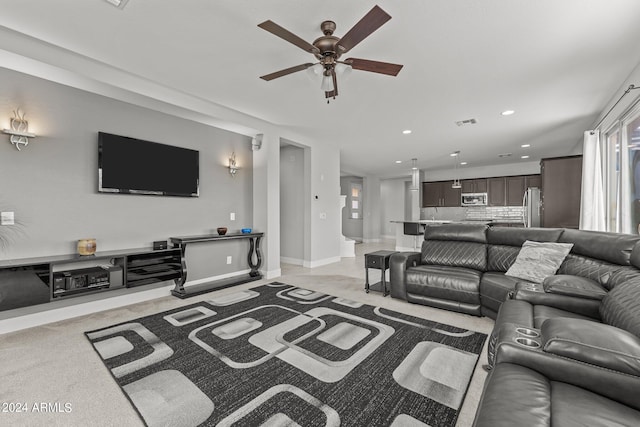 living room featuring ceiling fan