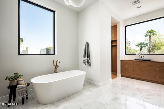 6584 E Gold Dust Ave, Paradise Valley, AZ 85253 - full bathroom with a soaking tub, baseboards, visible vents, and marble finish floor