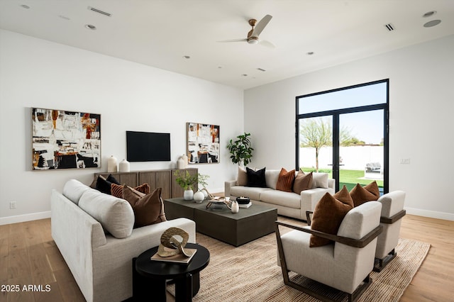6584 E Gold Dust Ave, Paradise Valley, AZ 85253 - living area with ceiling fan, baseboards, light wood-style floors, and visible vents