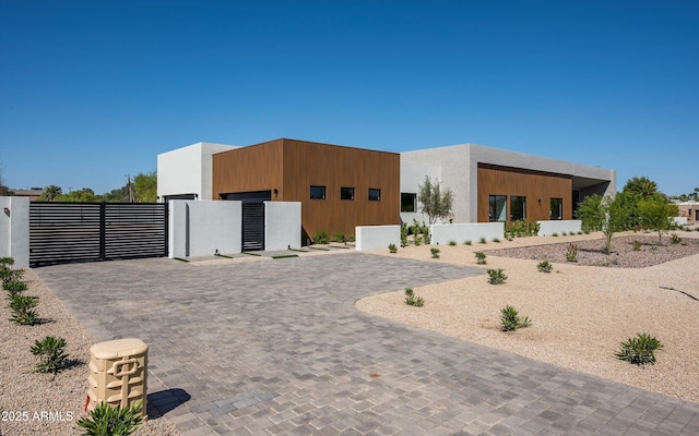 6584 E Gold Dust Ave, Paradise Valley, AZ 85253 - contemporary home with fence, a gate, and stucco siding
