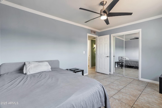 2823 W Banff Ln, Phoenix, AZ 85053 - bedroom featuring ornamental molding, light tile patterned flooring, ceiling fan, and a closet