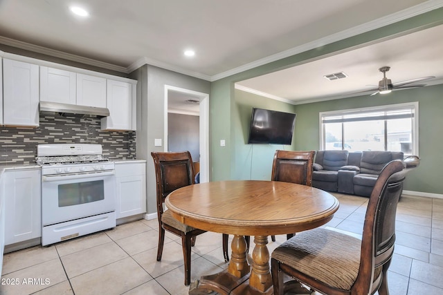 2823 W Banff Ln, Phoenix, AZ 85053 - dining area with light tile patterned flooring, ornamental molding, ceiling fan, and recessed lighting