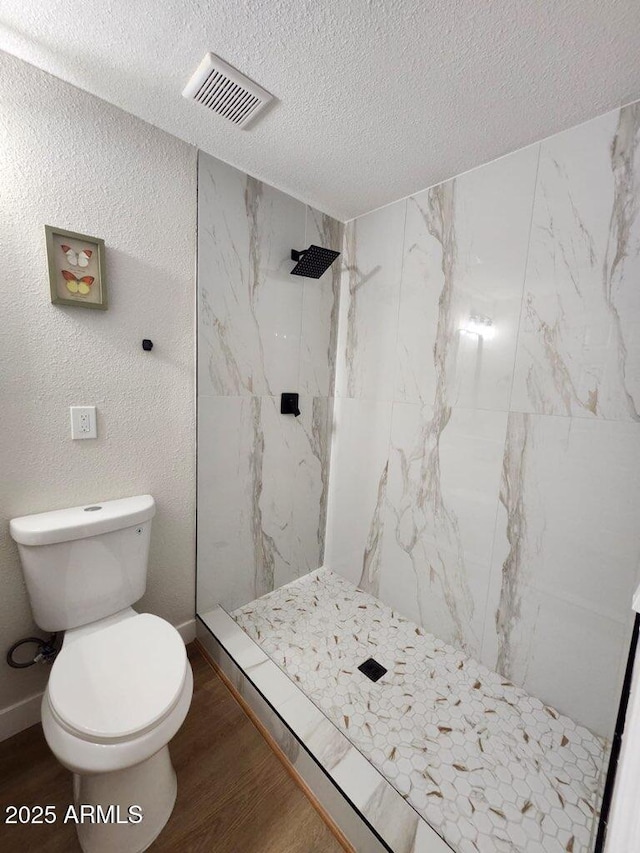 954 E Henry St, Tempe, AZ 85288 - bathroom featuring a textured ceiling, toilet, wood finished floors, and a shower stall