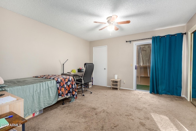 bedroom featuring ceiling fan, a textured ceiling, and carpet flooring