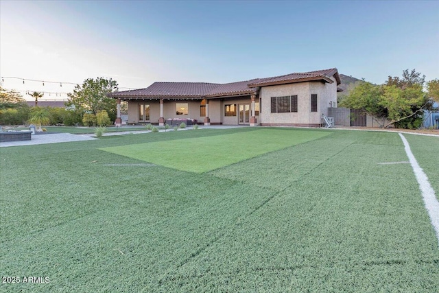 9183 W Shamel Ash Rd, Peoria, AZ 85383 - rear view of property with a tiled roof and stucco siding