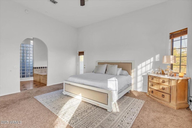 9183 W Shamel Ash Rd, Peoria, AZ 85383 - bedroom featuring light carpet, arched walkways, and a ceiling fan