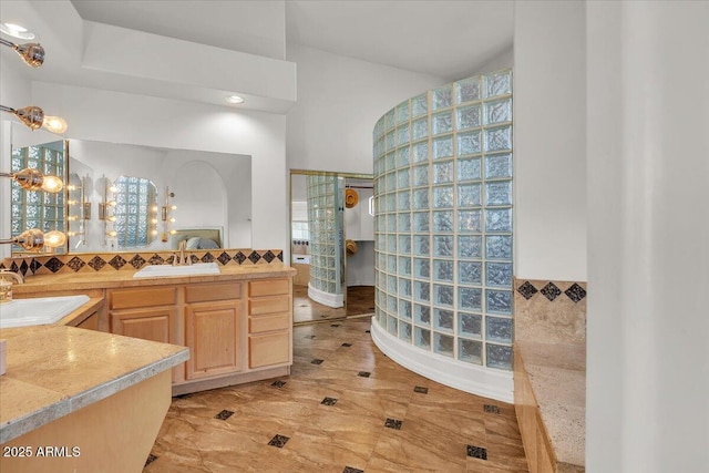 9183 W Shamel Ash Rd, Peoria, AZ 85383 - bathroom featuring walk in shower, vanity, and tasteful backsplash