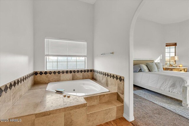 9183 W Shamel Ash Rd, Peoria, AZ 85383 - full bath featuring a tub with jets, connected bathroom, and wood finished floors