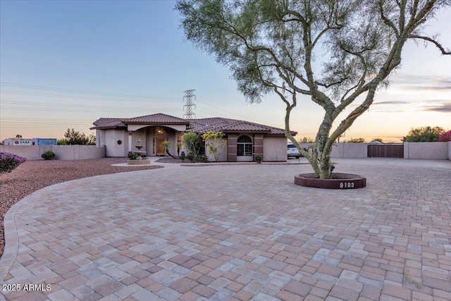 9183 W Shamel Ash Rd, Peoria, AZ 85383 - view of front of property featuring stucco siding, a tile roof, a gate, and curved driveway