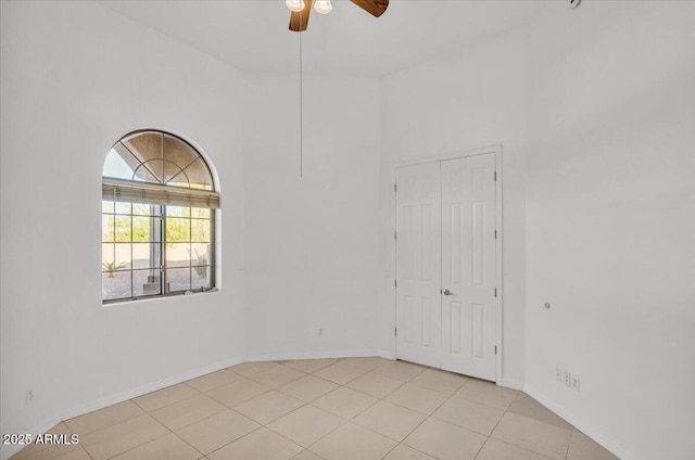 9183 W Shamel Ash Rd, Peoria, AZ 85383 - empty room featuring a ceiling fan and light tile patterned floors