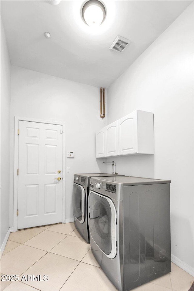 9183 W Shamel Ash Rd, Peoria, AZ 85383 - laundry room with washing machine and clothes dryer, cabinet space, and light tile patterned flooring