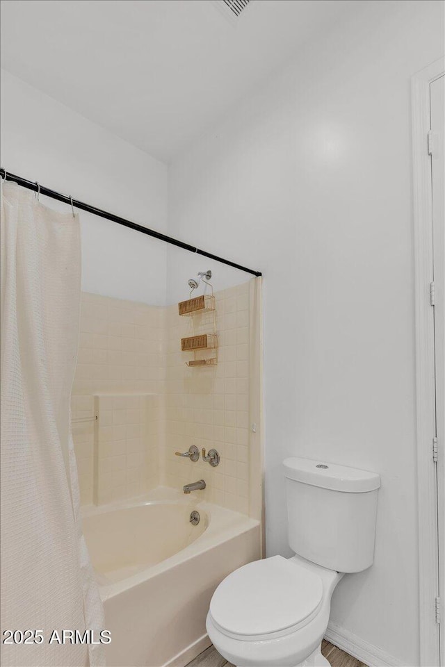 9183 W Shamel Ash Rd, Peoria, AZ 85383 - full bathroom featuring shower / bath combo with shower curtain and toilet