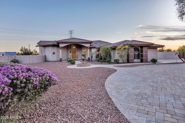 9183 W Shamel Ash Rd, Peoria, AZ 85383 - mediterranean / spanish house featuring stucco siding, a tile roof, a patio, and driveway