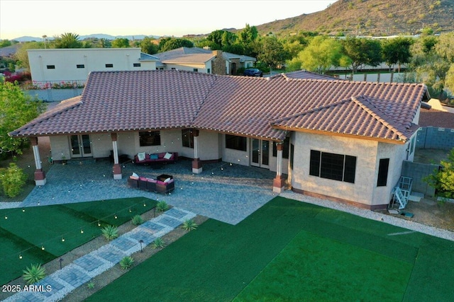 9183 W Shamel Ash Rd, Peoria, AZ 85383 - back of property featuring a mountain view, a tile roof, and stucco siding