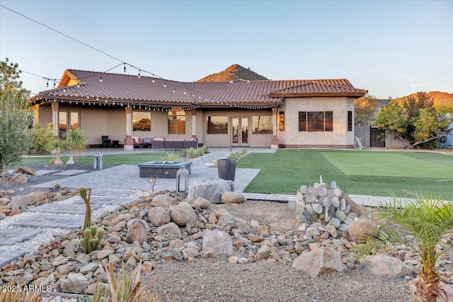 9183 W Shamel Ash Rd, Peoria, AZ 85383 - back of house with an outdoor hangout area, stucco siding, a patio, and french doors