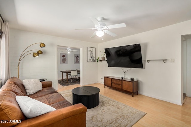 844 E Ruth Ave, Phoenix, AZ 85020 - living area featuring light wood-style flooring, a ceiling fan, and baseboards