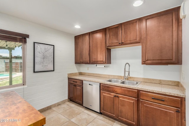 844 E Ruth Ave, Phoenix, AZ 85020 - kitchen featuring stainless steel dishwasher, a sink, light countertops, light tile patterned floors, and recessed lighting