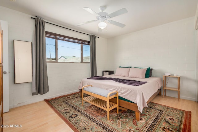 844 E Ruth Ave, Phoenix, AZ 85020 - bedroom featuring light wood-type flooring, concrete block wall, and a ceiling fan