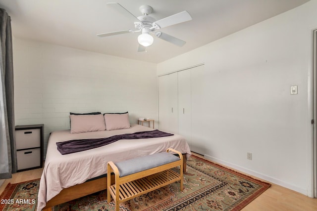 844 E Ruth Ave, Phoenix, AZ 85020 - bedroom with light wood-type flooring, a closet, baseboards, and ceiling fan