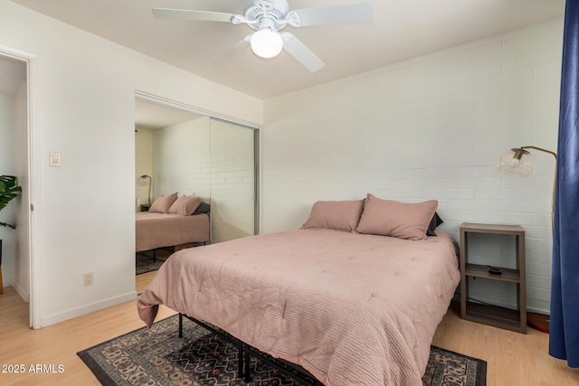 844 E Ruth Ave, Phoenix, AZ 85020 - bedroom with light wood-type flooring, a closet, a ceiling fan, and baseboards