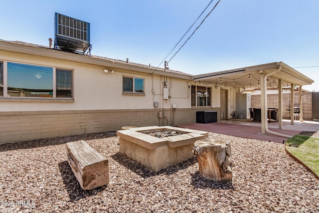 844 E Ruth Ave, Phoenix, AZ 85020 - back of property with an outdoor fire pit, a patio, and central AC