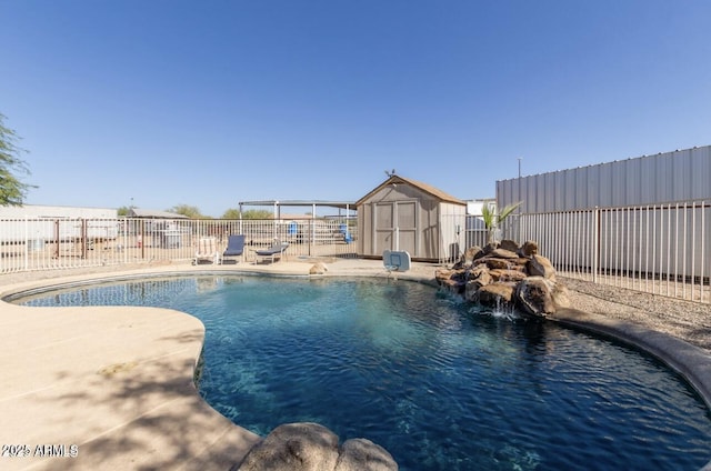 view of swimming pool featuring an outdoor structure, fence, a fenced in pool, a shed, and a patio area