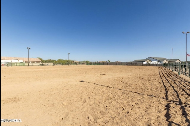 view of yard with an enclosed area and fence