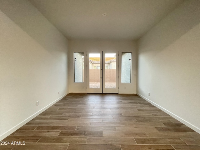 unfurnished room with french doors