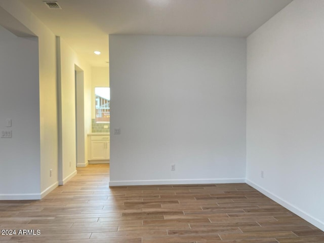 spare room with light wood-type flooring