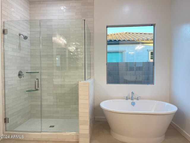 bathroom with shower with separate bathtub